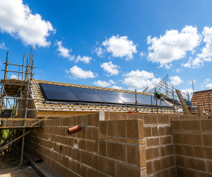 Modern new-build home under construction by RM Builders & Contractors featuring timber frame, structural steelwork and solar panels